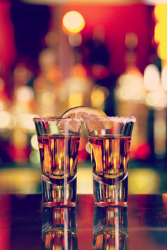 two shots of tequila with lime and salt