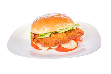 veal burger in bread bun with cucumber and tomato