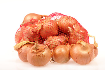 Onions in a net isolated on a white background