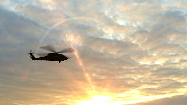 Black Hawk Helicopter Take Off silhouette in the sunse