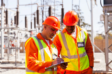 senior technician and electrical engineer in substation