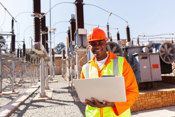 african electrical engineer using laptop computer