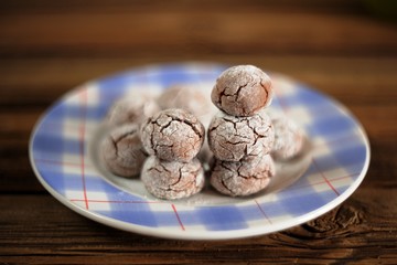 Homemade chocolate ball biscuits on a blue plate