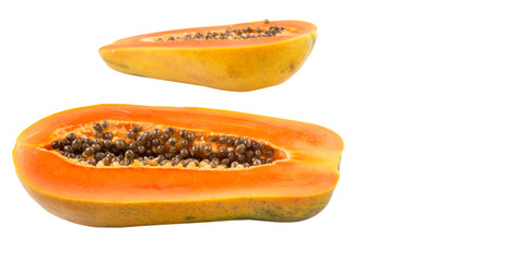 Cut papaya fruit over white background