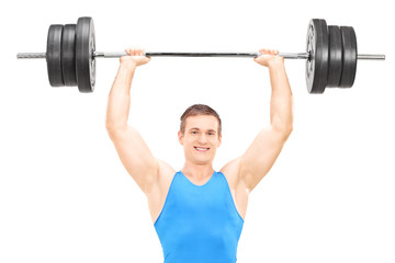 Fototapeta na wymiar Male weightlifter holding a barbell