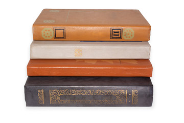 Pile of old books on white background