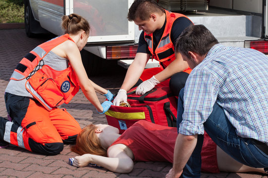 Emergency service helping woman