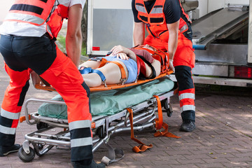 Woman after accident on the stretcher