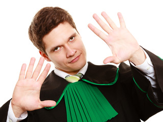 Law. Man lawyer in polish gown showing stop hand sign