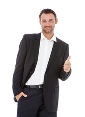 young smiling business man showing thumbs up