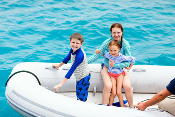 Family in inflatable dinghy boat