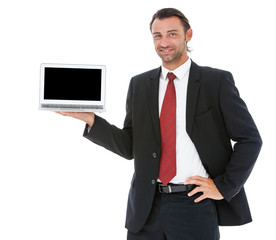 Handsome young business man working on his laptop