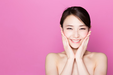 attractive asian woman on pink background