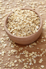 Rolled oats in a wooden bowl
