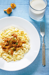scrambled eggs with fried chanterelles