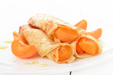 Crepes with apricot slices