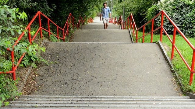 Man Goes Up The Stairs - Nature - Shot From Above