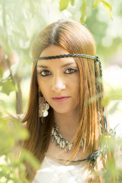 Closeup portrait of beautiful hippie young woman, outdoor.