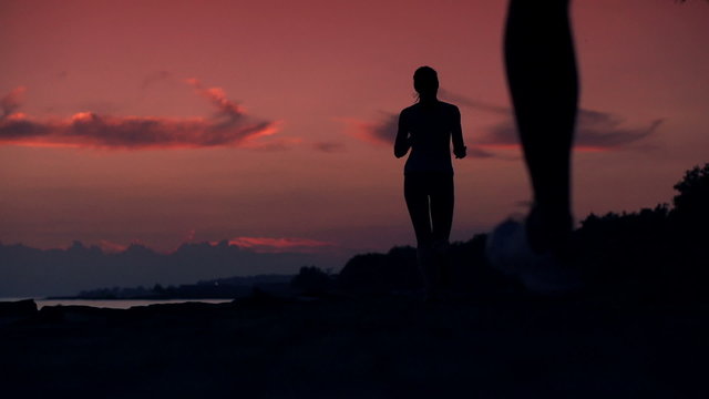 People jogging during beautiful sunset