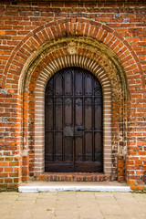 old door of medieval Cistercian monastery in Kolbacz, Poland