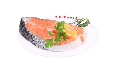 Beautiful raw salmon steak with herbs.