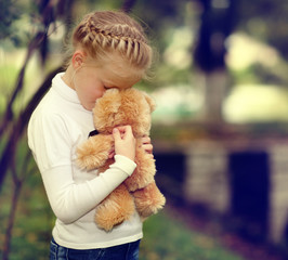 sad girl with teddy bear