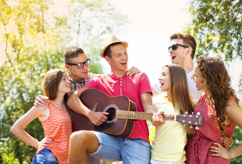 Friends having fun with guitar