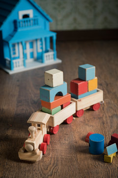 Wooden toy train and doll house