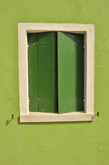 Green window in Burano, Venice, Italy