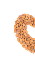 Obraz premium Almonds in half of heart shape.