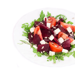 Beet salad with tomatoes and feta cheese.
