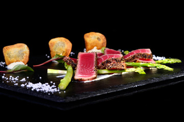 Tuna on black background