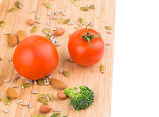 Vegetables on wooden platter.