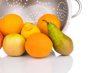 Close up of fruits in colander.