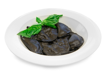 black dumplings on a plate