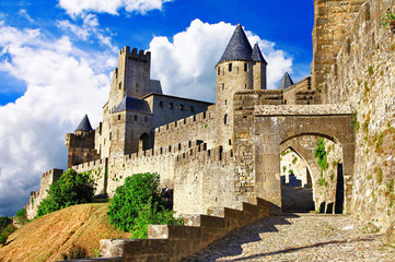 Carcassonne medieval castle gate and massive stone towers view in France. UNESCO fortress fortification walls without people. Ancient Cite chateau architecture and bastion  © Freesurf