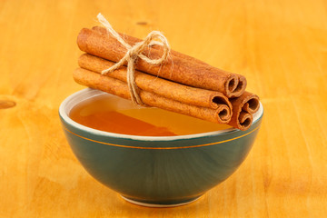 Honey and cinnamon in bowl