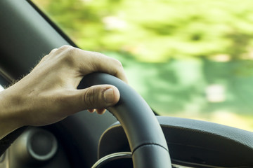 holding steering wheel