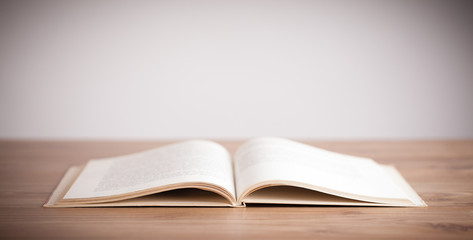 Open book on wooden deck
