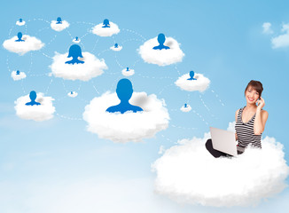 Young woman sitting in cloud with laptop