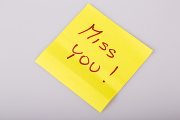 Yellow note paper miss you message