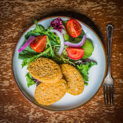 Chicken nuggets with salad