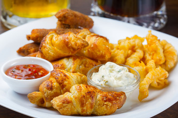 Fresh golden croissants with jams