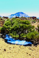 Desert with sun and snow near Teide volcano (Tenerife)