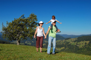 Family summer vacation in mountains