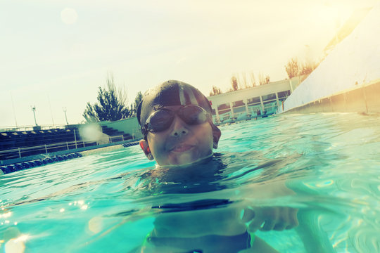 Boy In Swimming Pool Half In Water Instagram Style Image