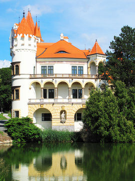 Chateau Zinkovy mirroring in a lake, West Bohemia.
