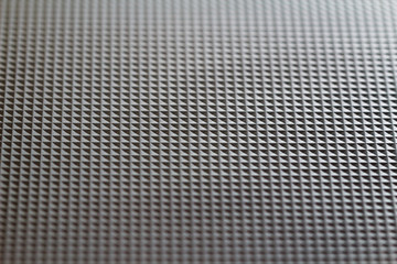 Structure from identical squares on black plastic