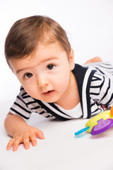 isolated studio portrait lovely toddler baby boy playing