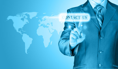 businessman hand pushing contact us button